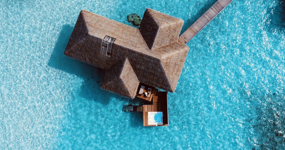 brown wooden cross on blue surface