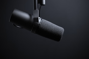black and silver microphone with white background