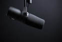 black and silver microphone with white background