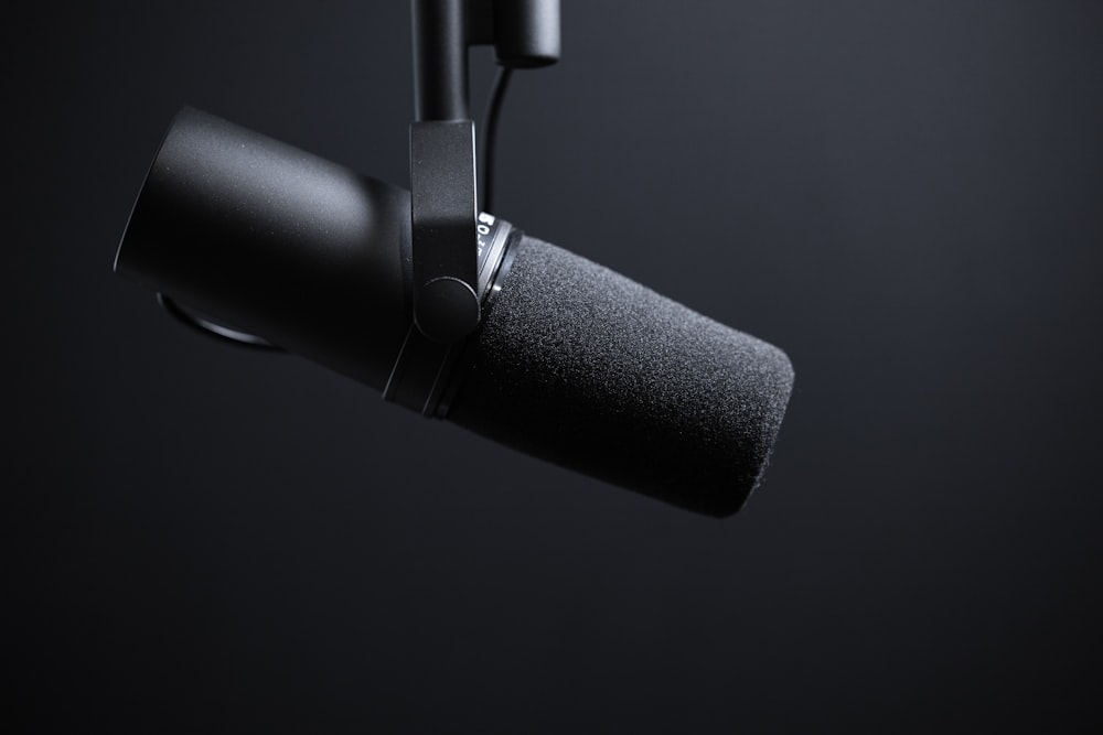 black and silver microphone with white background