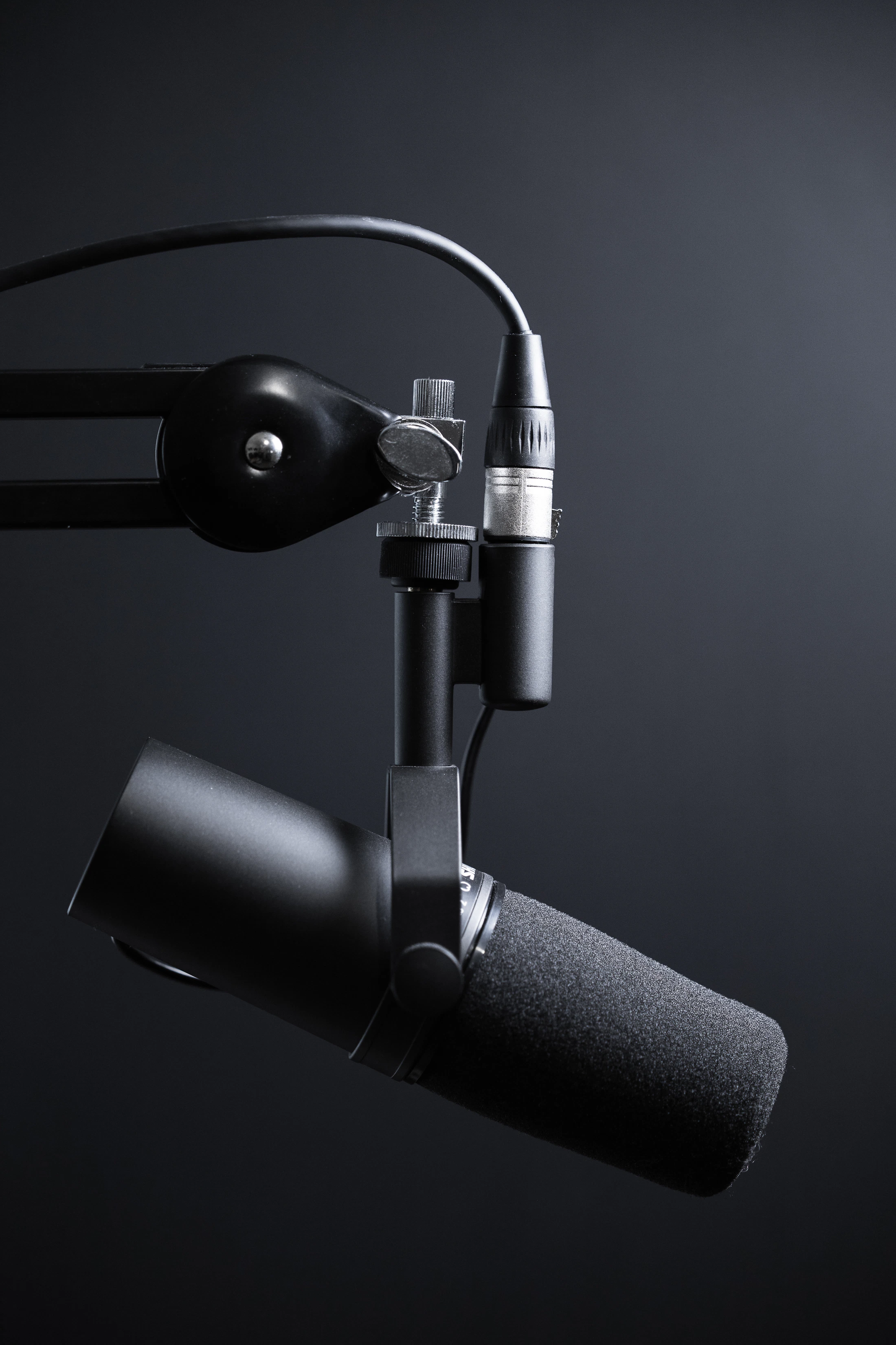 Premium podcast studio microphone representing trust through expert conversation
