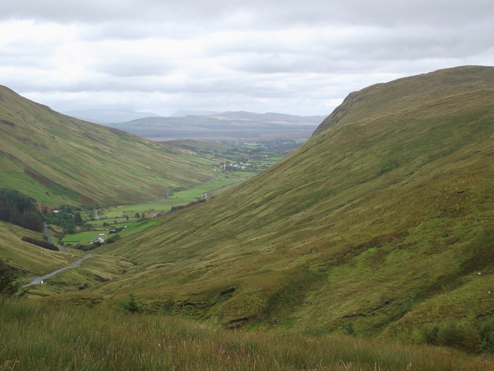 green mountains under white clouds during daytime