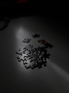 Screenshot of a dark, atmospheric puzzle game with glowing elements.