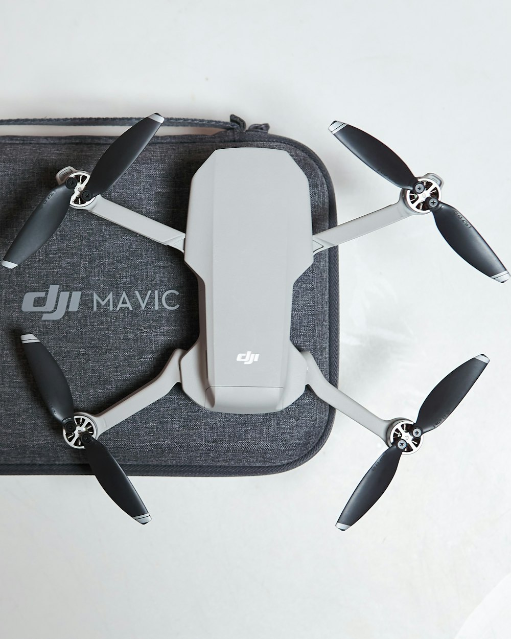 a dji mavicc is laying on top of a case