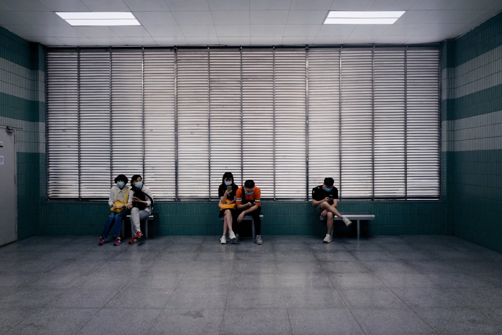 people sitting on green chairs