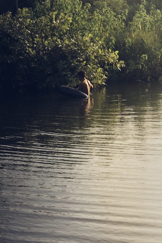 woman in black bikini on body of water during daytime in Chikhli India