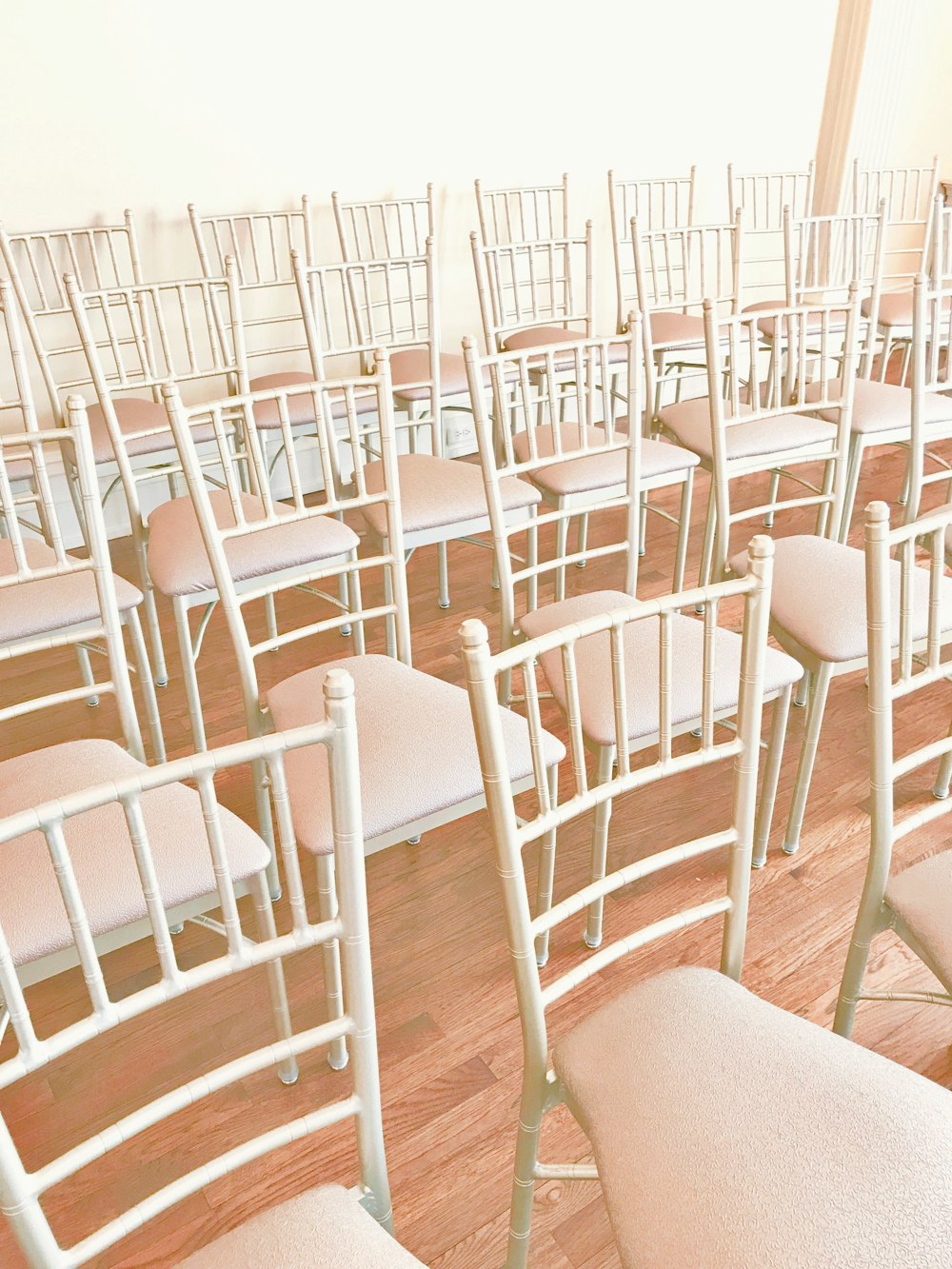 white plastic chairs on white floor