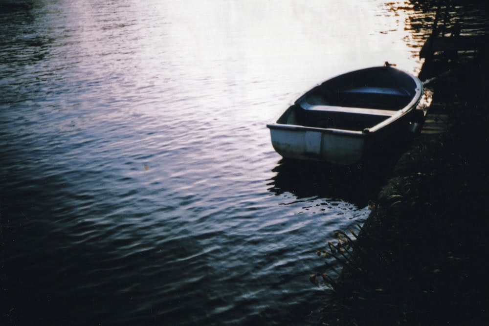 gray boat on body of water during daytime