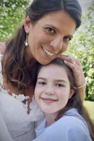 A candid moment of a woman embracing a loved one, radiating warmth and resilience.