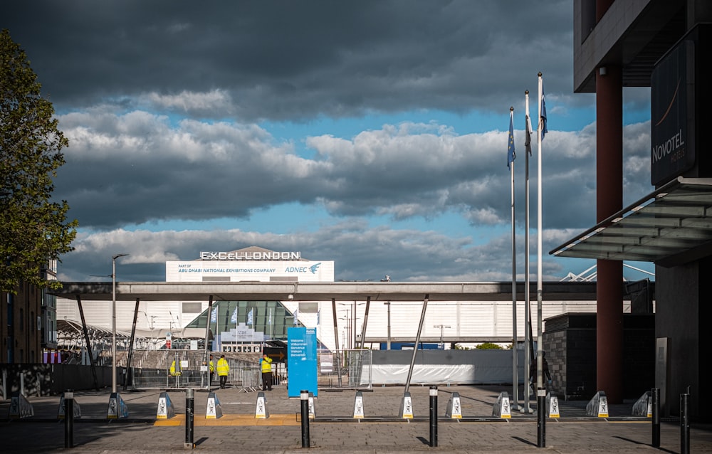 white and blue concrete building under white clouds during daytime