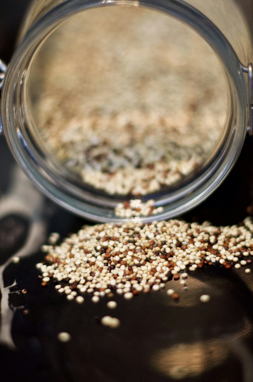 brown coffee beans in clear glass jar