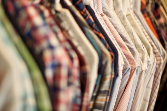 assorted clothes hanged on clothes hanger