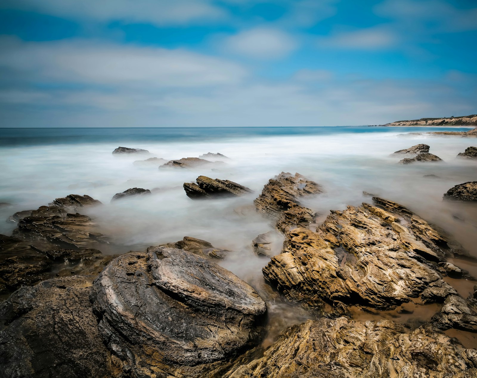 Leica SL2 sample photo. Brown rocks on sea photography