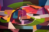 An abstract artwork featuring an array of geometric shapes interwoven in a dynamic composition. The painting includes a vibrant mix of colors and forms that suggest movement and depth, with curved and angular shapes overlapping and interacting.