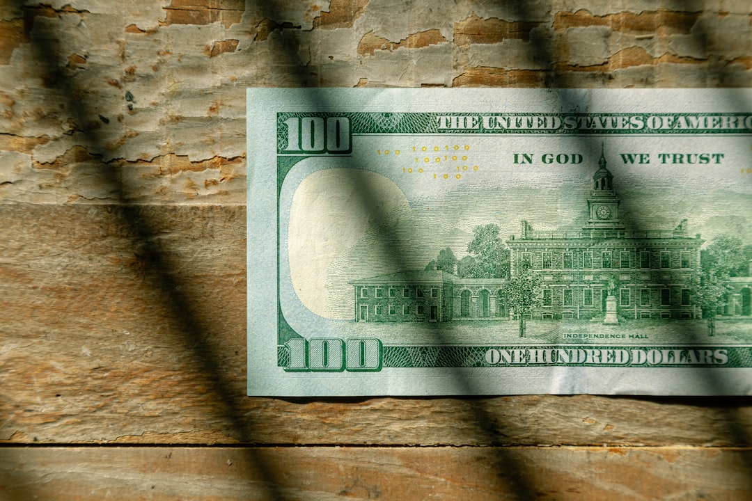 100 us dollar bill, US Currency One hundred dollar bill flat lay on wood background