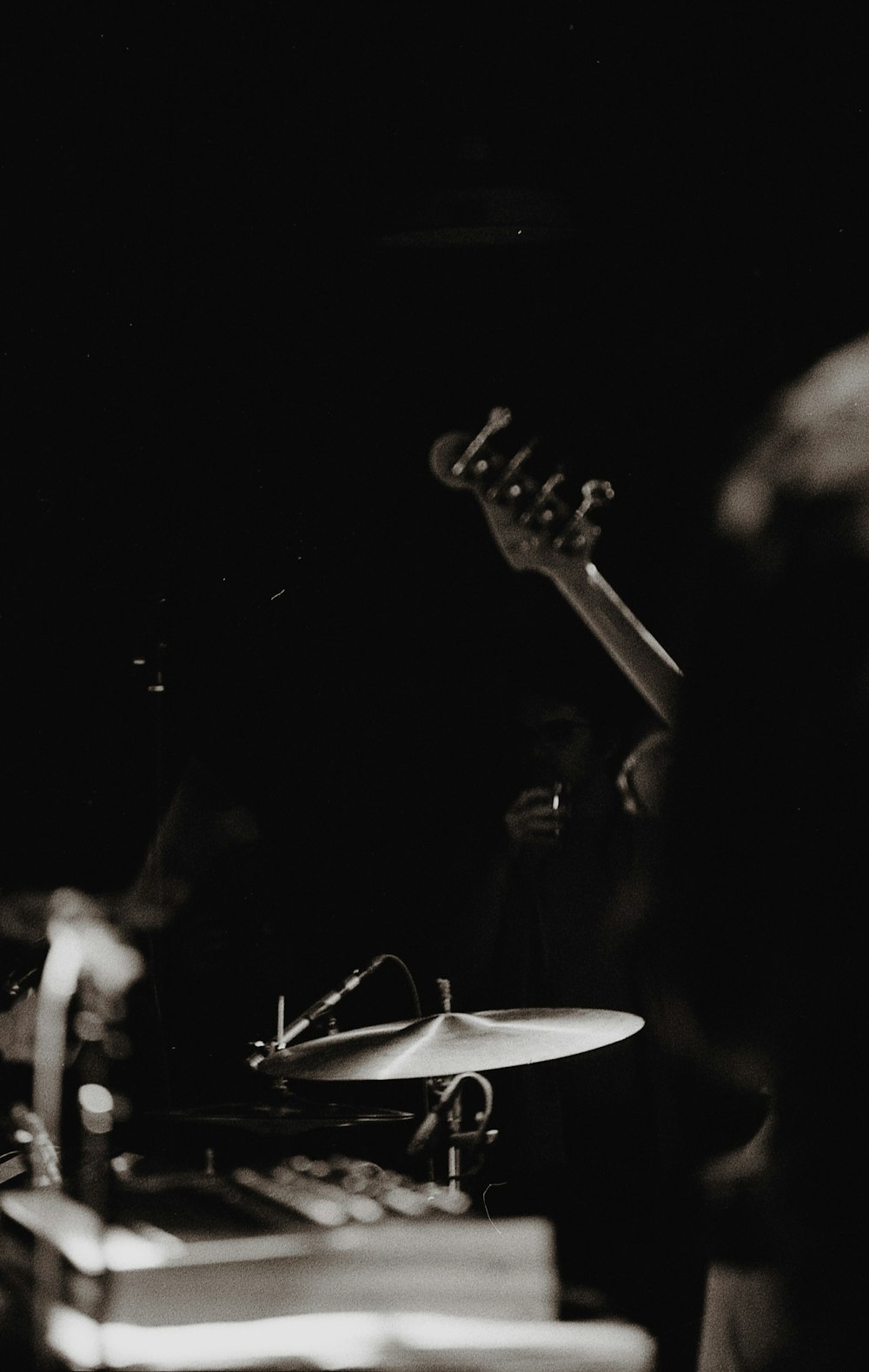 man playing guitar on stage