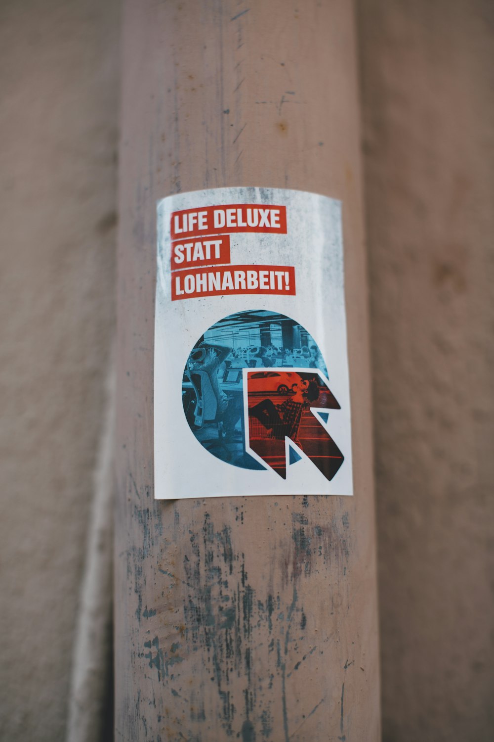 a sticker on the side of a pole