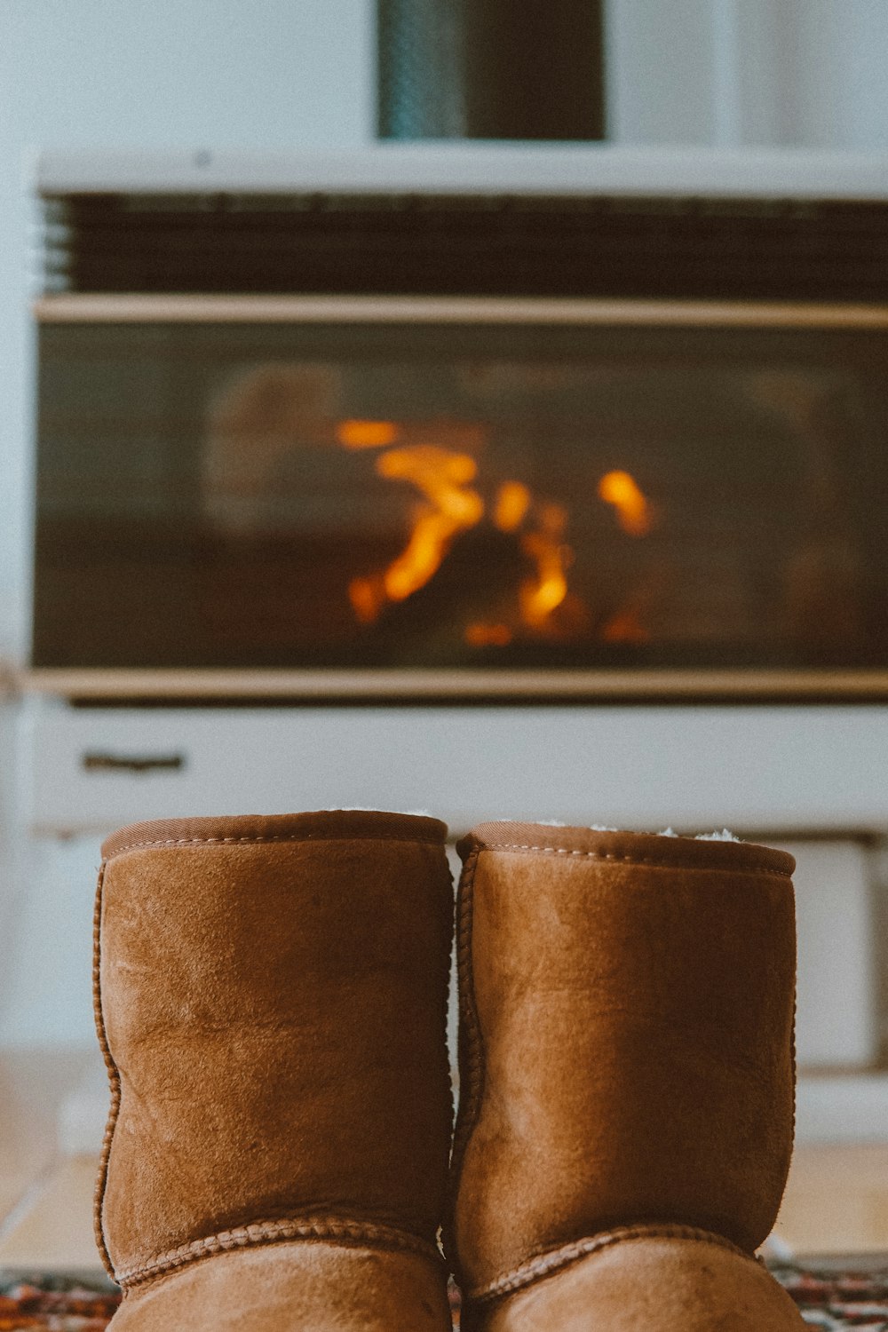 brown leather textile near fireplace