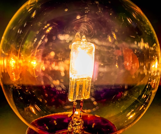 A close-up of a glowing light bulb symbolizing innovation.