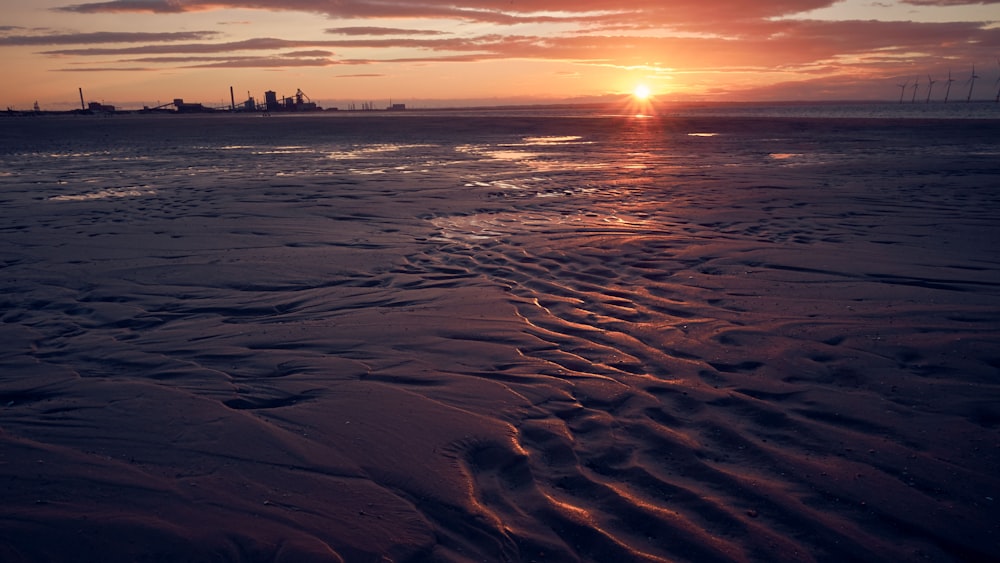 body of water during sunset