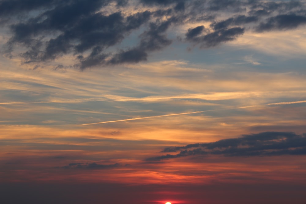 orange and blue cloudy sky during sunset