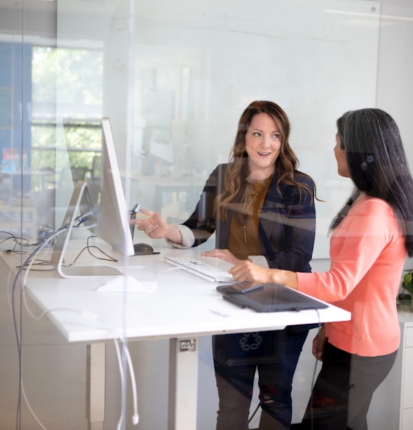 2 women sitting at table