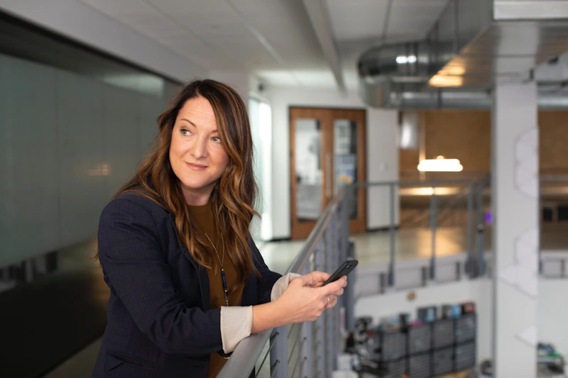 woman holding smartphone for private dating messages