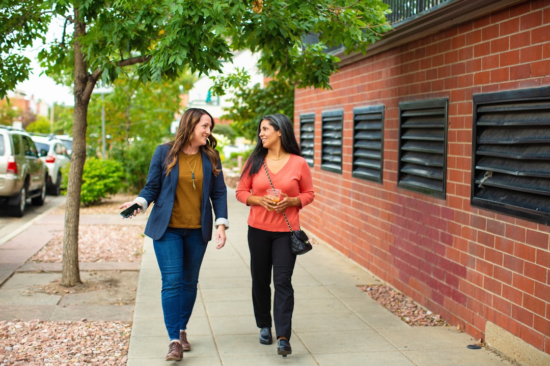 sisters talking privately on a walk outdoors