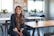 woman in black blazer sitting on chair