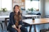 woman in black blazer sitting on chair