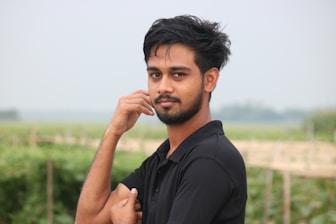 man in black polo shirt