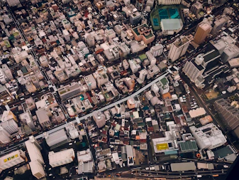 an aerial view of a city with lots of buildings