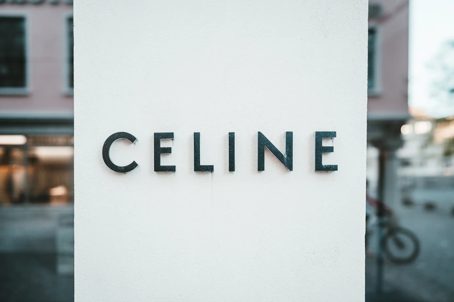 A sleek black background with bold white capital letters spelling CACLES F-C, highlighting the men's collection.