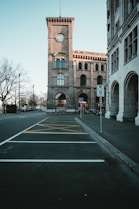 brown concrete building near bare trees during daytime