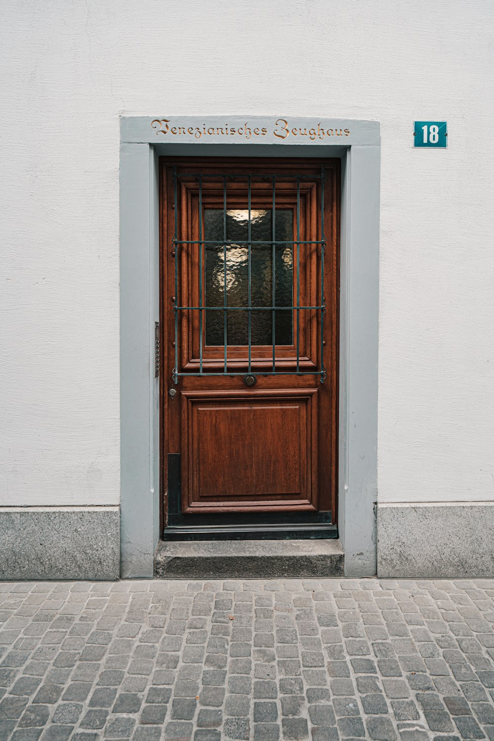 brown wooden door with glass panel