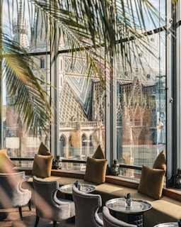 A cozy café setting with a view of Monserrate Palace.