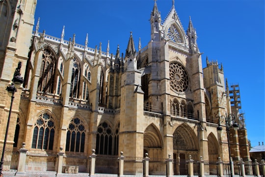 brown concrete building under blue sky during daytime in Catedral de León Spain