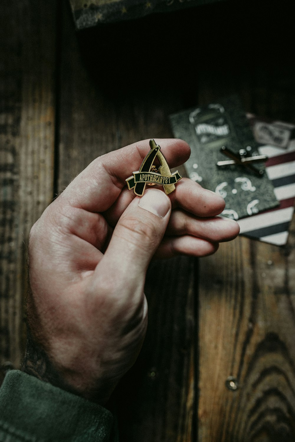 person holding gold and silver accessory