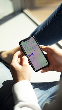 A morning scene with a smartphone showing the daily digest app, sunlight streaming through a window.