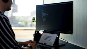 person using black laptop computer