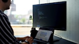 person using black laptop computer