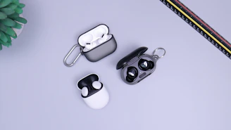 black and white headphones on white table