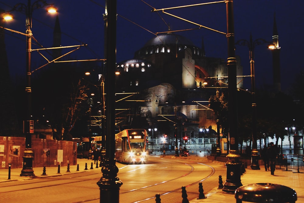 black street light near white concrete building during night time