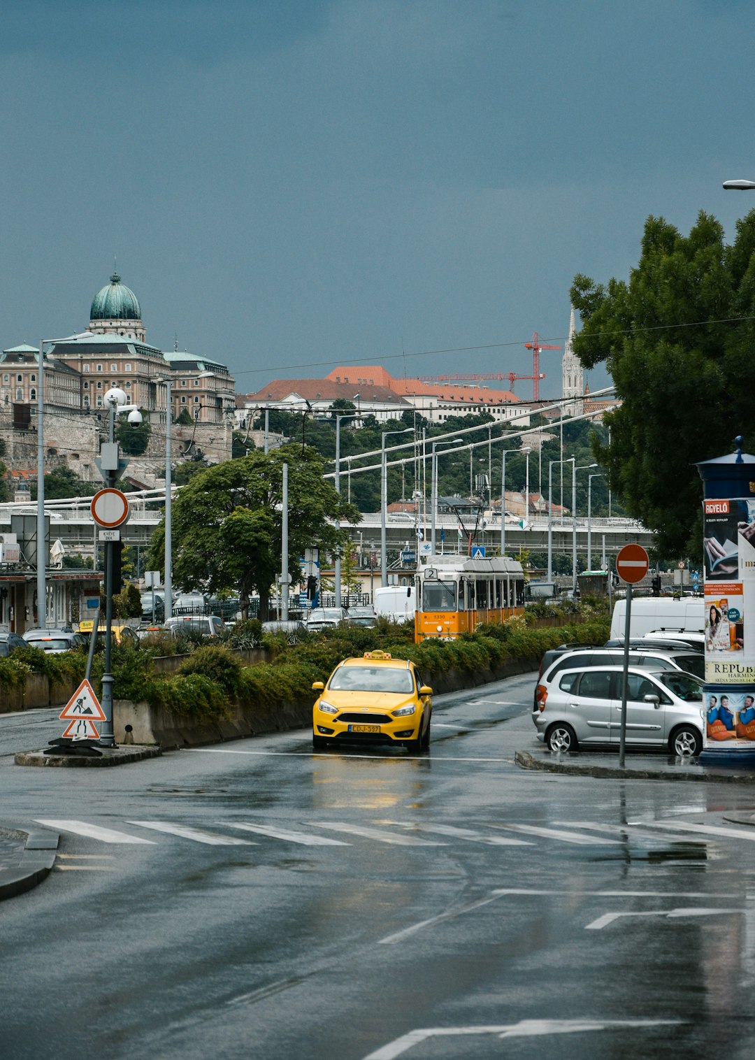 cars on road near buildings during daytime