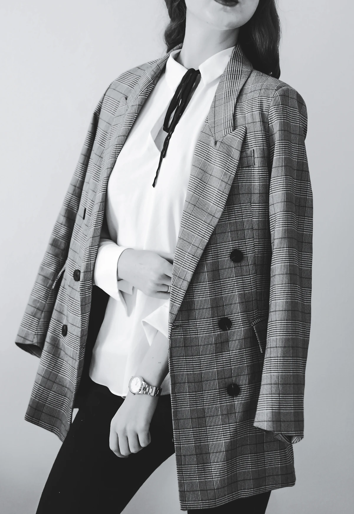 Prince-of-Wales check blazer worn over a white shirt