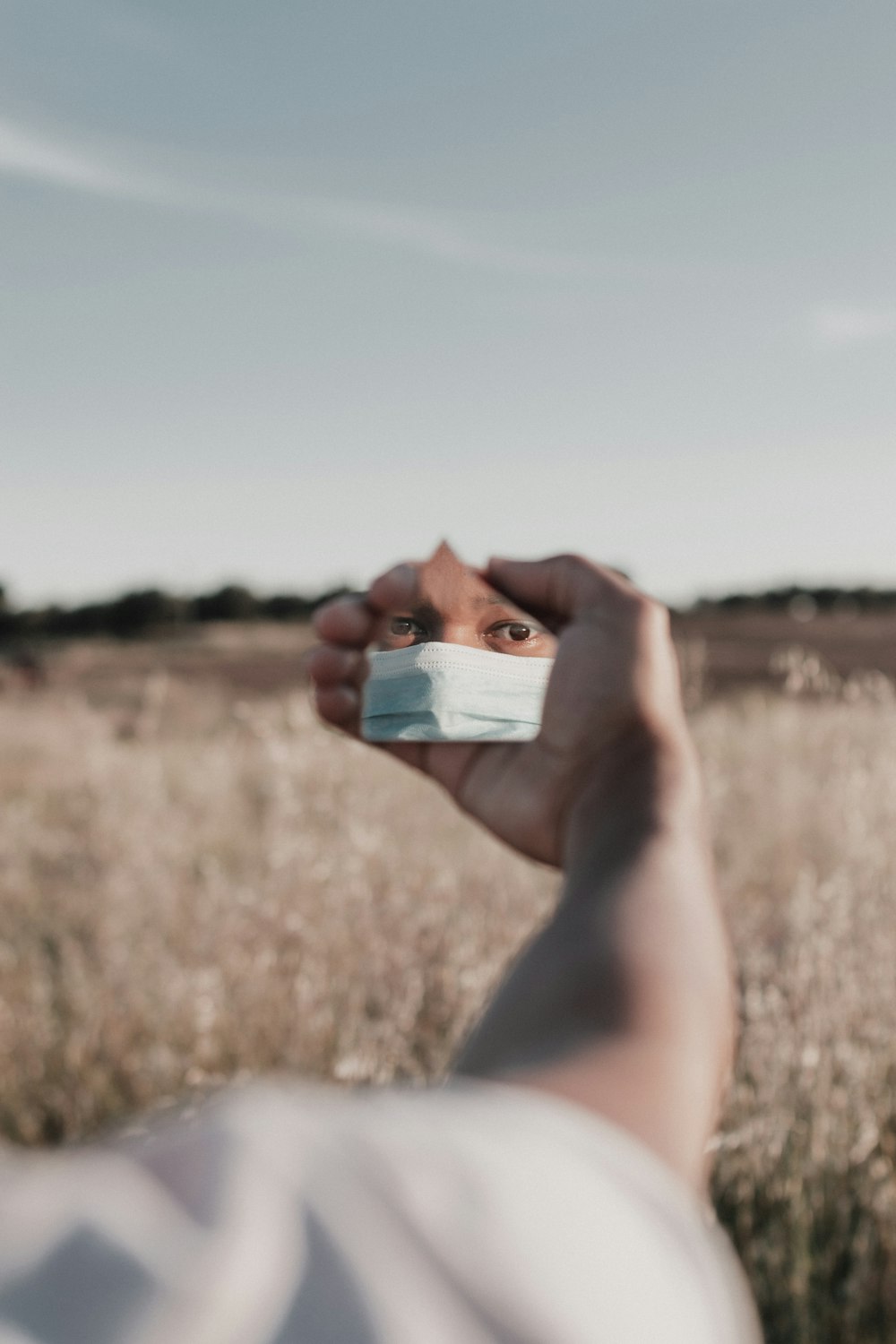 person holding white and blue box