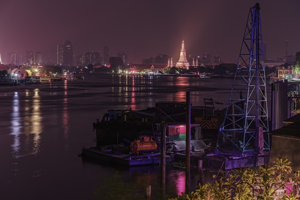 blue and red boat on water during night time