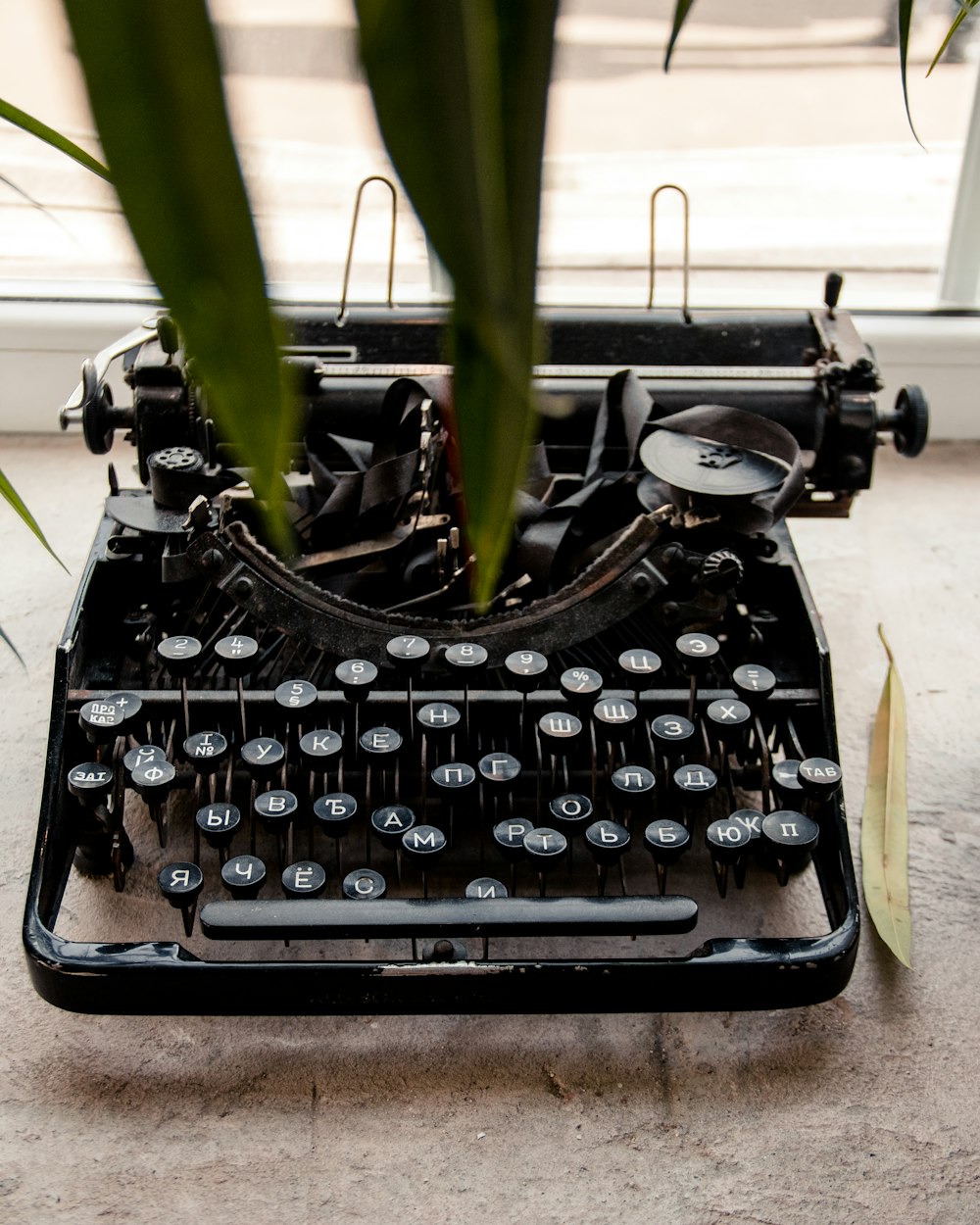 black typewriter on white table