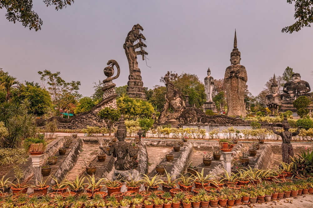 brown concrete dragon statues under gray sky