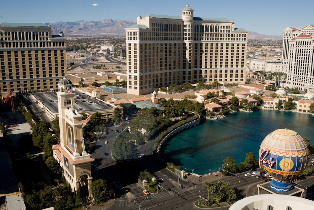 aerial view of city buildings near body of water during daytime